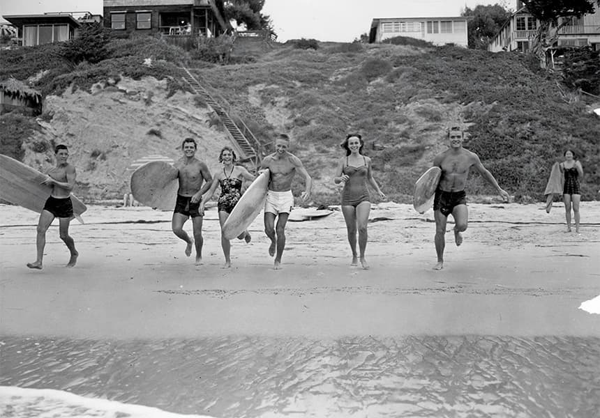A vintage photo of a group of surfers