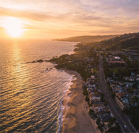 Aerial view of the beach and town at sunset