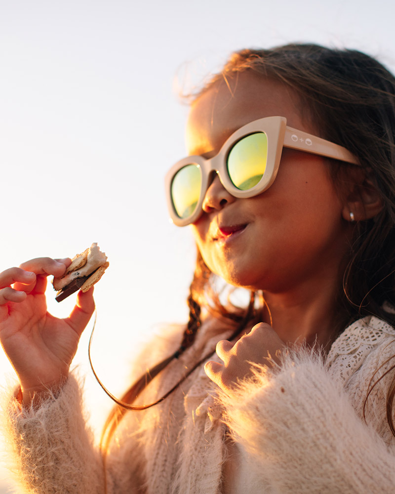 Girl eating s'more.