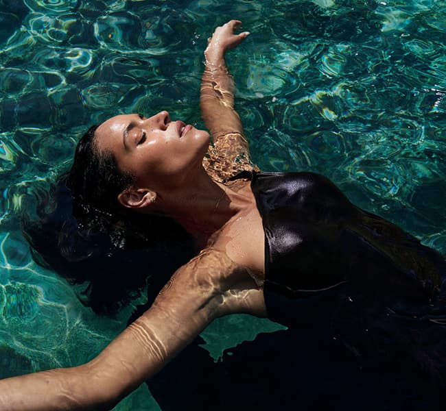 A woman floating in the pool