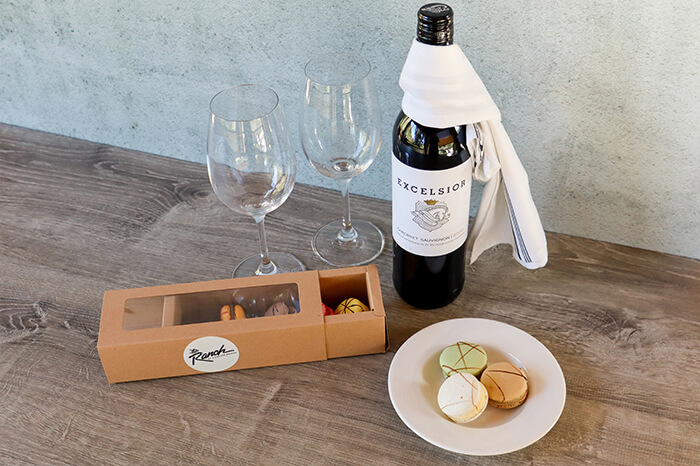 French Macarons and Red Wine on a table
