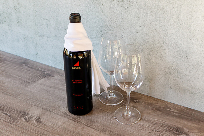 Justin wine bottle with glasses