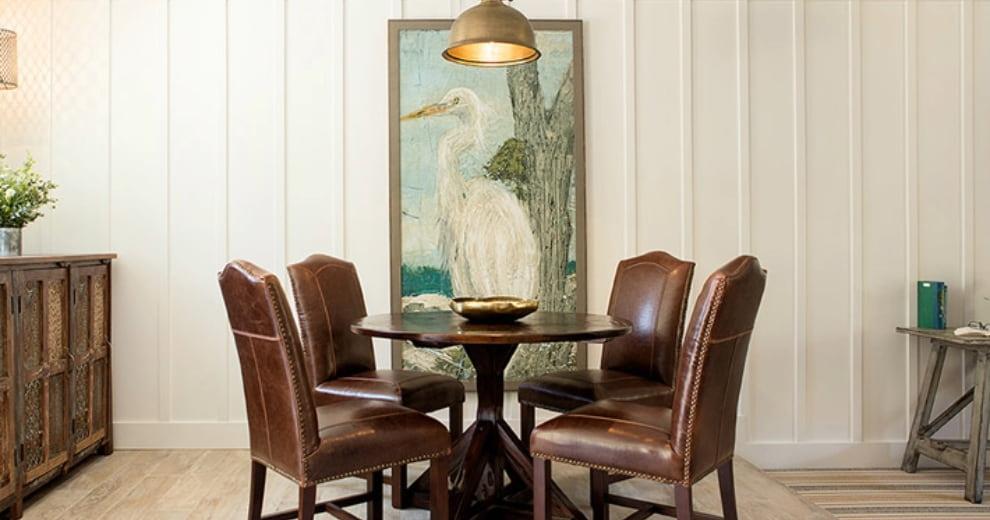 dining area with stork painting in background